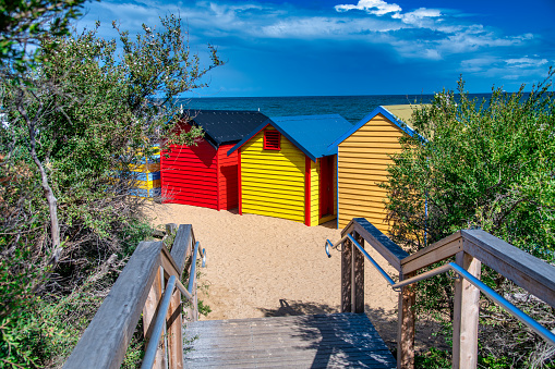 Colorful huts in Brighton Beach on a sunny morning, Australia