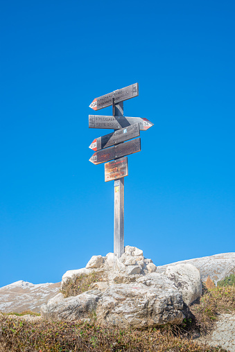 Trailhead pointers at the famous Strudelkopf peak trail in Fanes-Sennes-Prags National Parks, in magical Dolomites, and near national park Three Peaks (Tre Cime, Drei Zinnen), South Tyrol, Italy, sunny day