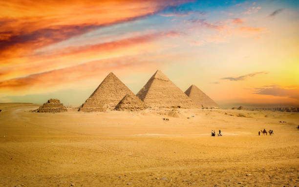 istock Egyptian pyramid in sand desert 1363614849