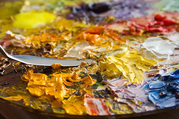 istock mixing oil paints with a brush 136362076