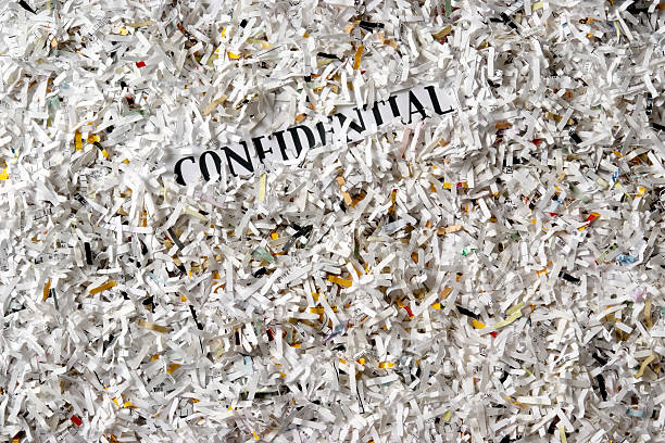 istock Overhead shot of many shredded confidential documents 136362092