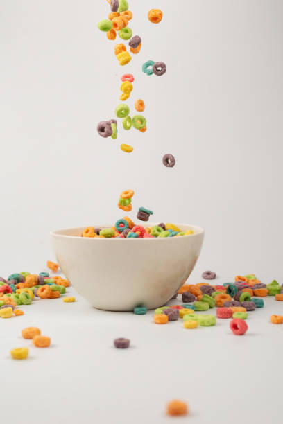 istock Colorful cereal box for morning breakfast. Corn flakes falling to the white bowl. Motion. 1363621029