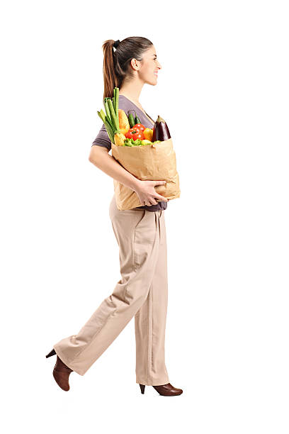 istock Female holding a paper bag with groceries 136362214