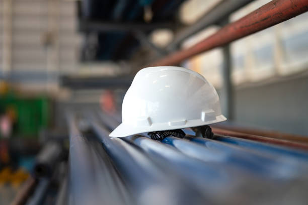 istock A white safety helmet or hardhat - industrial working PPE. 1363622797