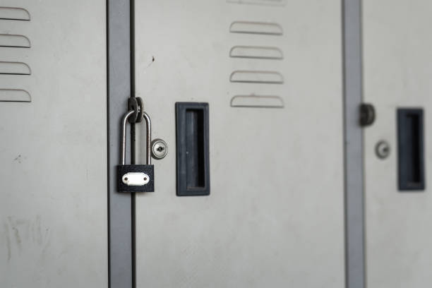A Close-Up Of An Unlocked Metal Latch On A Weathered Door, Symbolizing Access, Vulnerability, Entry, And The Absence Of Security.