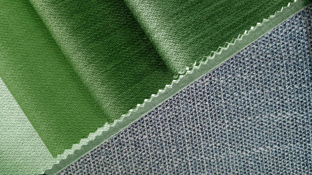 istock close up green tone fabric samples in catalog book matching with grey textile linen drapery fabric. combination of interior fabric samples for drapery or upholstery works. 1363625067