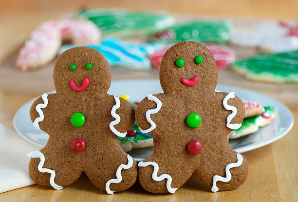 Gingerbread Men with cookies in background