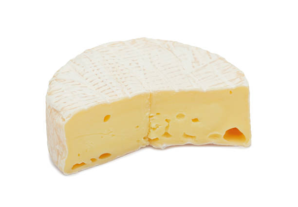 istock Round Brie cheese, with a section cut out, isolated 136362623
