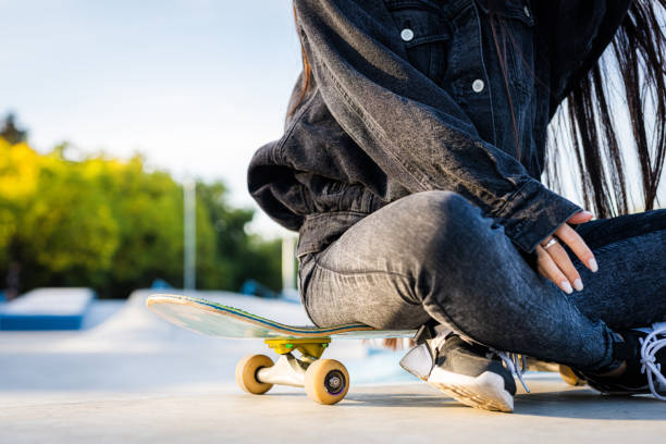 istock Young female skateboarder at skate park 1363626263