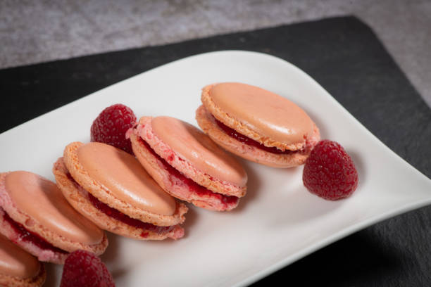istock Pastry, Macaroon recipe with raspberry cream filling 1363626386