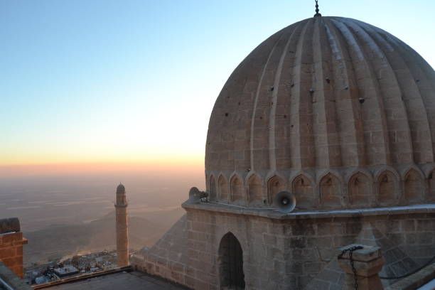 istock Sunset in Mardin Turkey with dome of a building 1363628016