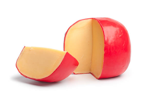 Dutch Edam cheese with a quarter part Dutch Edam cheese with a quarter part on white background edam stock pictures, royalty-free photos & images