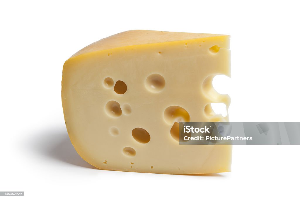 Piece of Dutch farmers cheese with holes Single piece of Dutch farmers cheese with holes on white background Farmer's Cheese Stock Photo