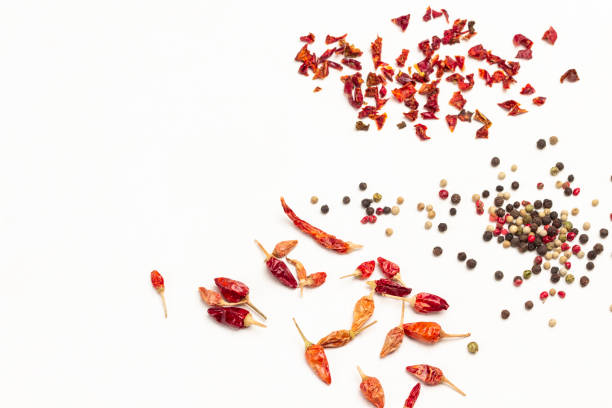 istock Dry pepper pods, allspice, and dry pepper petals on table. 1363629332