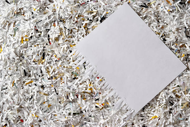 istock Overhead shot of many shredded documents with blank paper 136363109