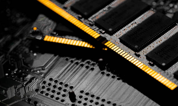 istock Macro Close up of computer RAM chip and motherboard 1363632012