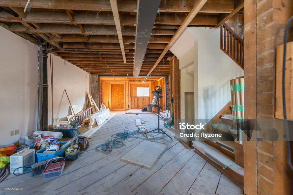 Retrofit at a residential house Residential construction site of a house in Toronto, Ontario- Canada. Welded Steel beam is visible on the ceiling. Construction tools, material supplies and design plans. Real estate home remodelling. Building - Activity Stock Photo
