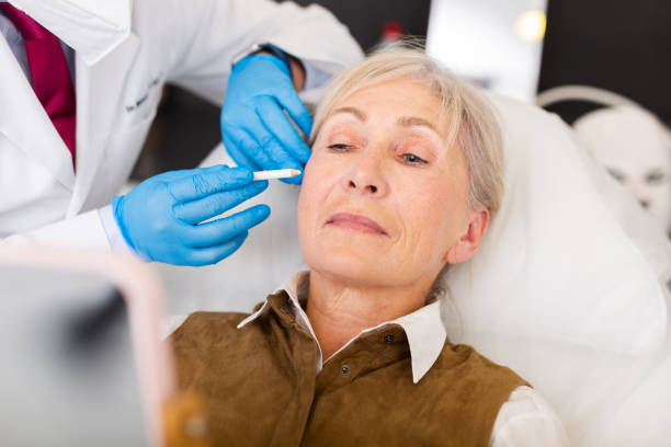 istock Cosmetologist doing botulotoxin injections for senior woman 1363633139