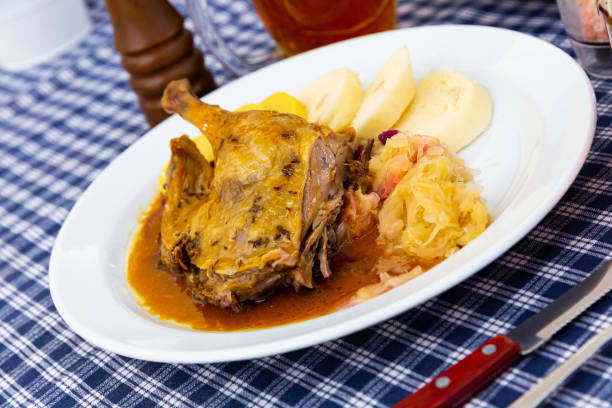 istock Roasted quarter duck with red and white cabbage, bread and potato dumplings 1363634760