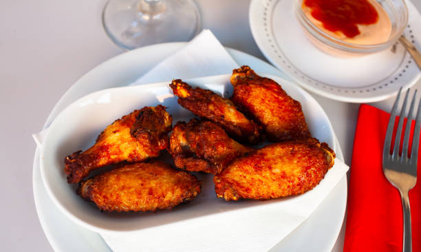 istock Delicious pan-fried chicken wings with crispy crust 1363635561