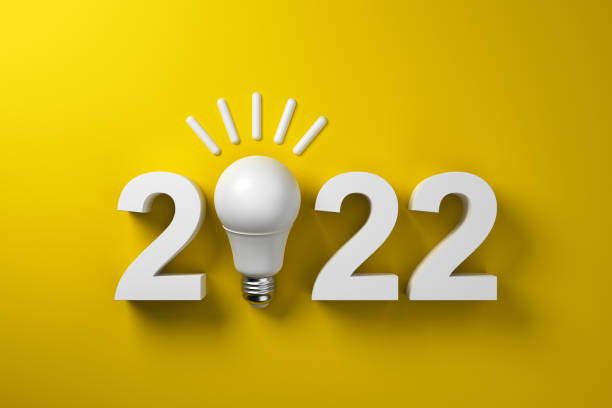 istock 2022 and white lamp on a yellow background. 1363635927