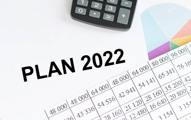 istock 2022 plan text on notepad on the background of colored graphs and reports on the table 1363636155