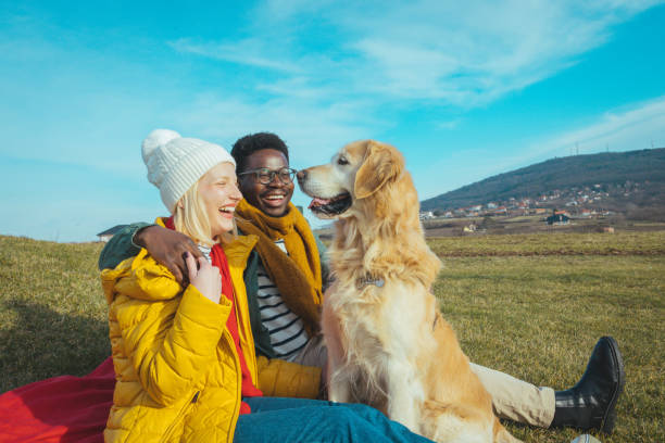 istock Couple playing with dogs 1363637781