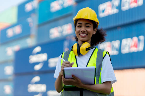 istock Foreman or worker hand holding checklist for writing and checking in goods in container at Container cargo site. 1363637795