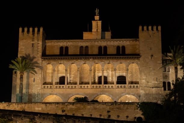 General view of the Almudaina Palace, Palma de Mallorca at night illuminated