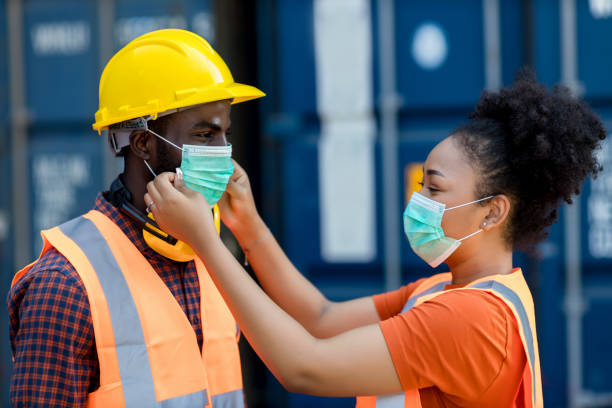 istock Wife puts a medical mask on her husband before work. Coronavirus, illness, infection, quarantine, medical mask, COVID19. Couples wear facemask before work during coronavirus, flu outbreak. 1363638026