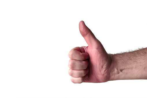 Caucasian male hand doing a thumb up gesture on white background