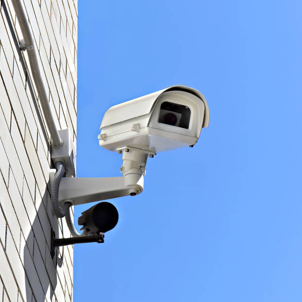 istock video surveillance camera on a wall of the building 1363644927