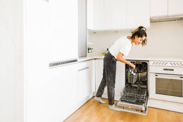 istock happy young woman doing housework in her kitchen 1363656413