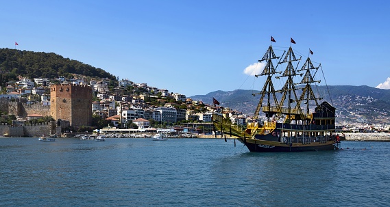 Alanya, Turkey, September 11, 2021: A historic ship departs from the port in this tourist resort on a sunny summer day.