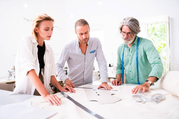 istock Team of fashion designers at work 1363657797