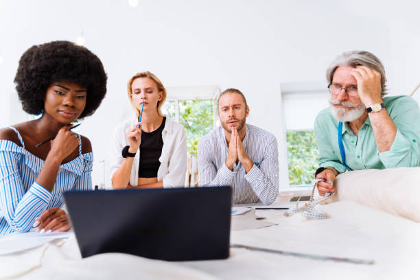 istock Team of fashion designers at work 1363659389