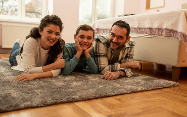 istock Happy family posing on floor at home 1363661468
