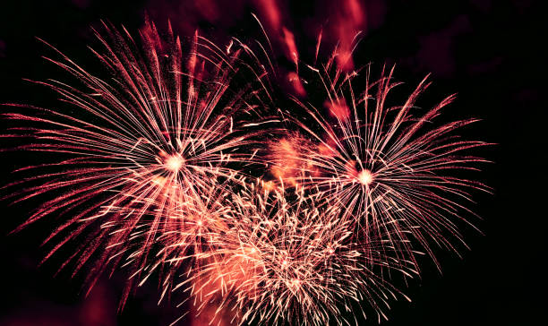 istock Red yellow fireworks with smoke close-up at black night sky 1363666881