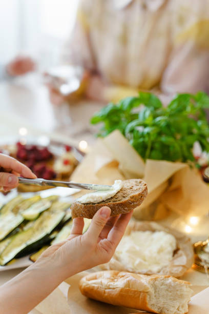 istock Woman making a sandwich at the festive table. 1363675977