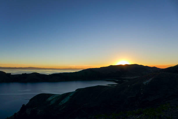 istock Isla del Sol sunset behind mountains on Lake Titicaca 1363676508