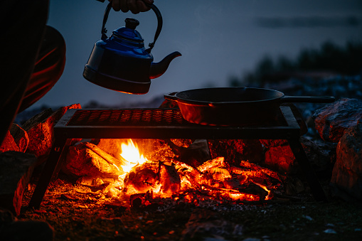 Preparing Food Over the Campfire