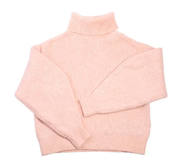 Pink turtleneck sweater isolated on white, top view