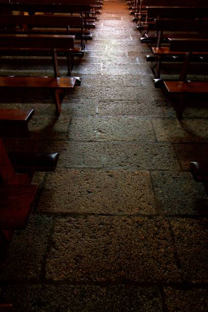istock Light on stone tiles in old church 1363678826