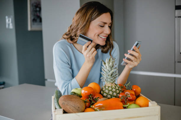 istock Ordering groceries online and paying contactless 1363679353