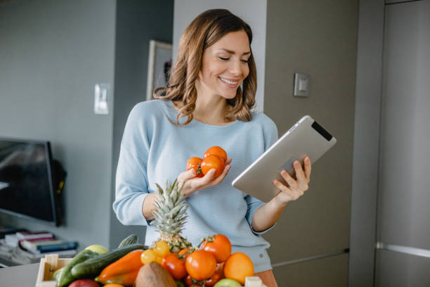 istock Young woman searching for recipes online 1363680856
