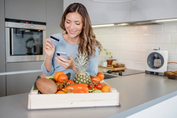 istock Ordering groceries online and paying contactless 1363680952