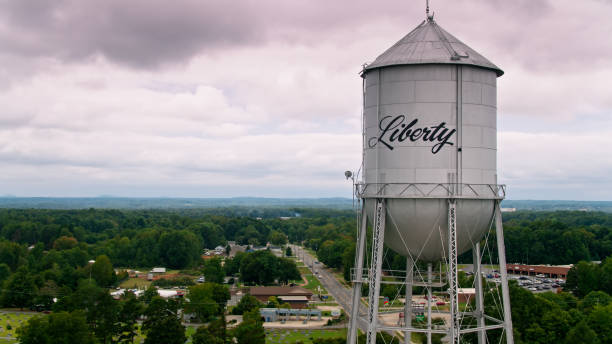 istock Water Tower in Small Town Called Liberty - Aerial 1363681024