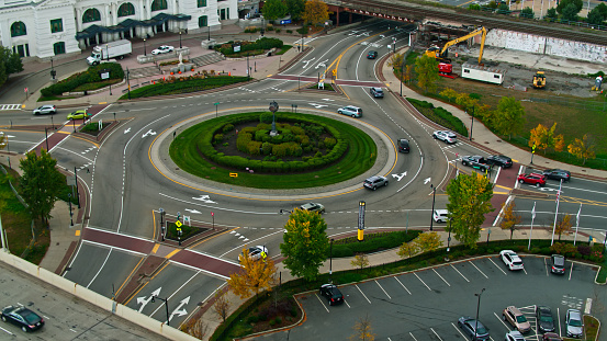 Aerial still featuring the Washington Square Rotary Clock and roundabout near Union Station in Worcester, Massachusetts. \n\nAuthorization was obtained from the FAA for this operation in restricted airspace.