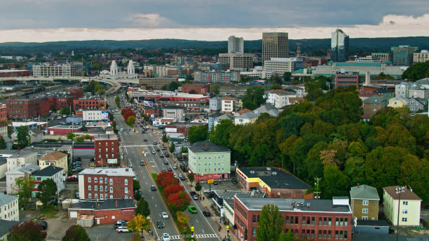 Wide Street Through Residential Area of Worcester, MA - Aerial Aerial view from over Shrewsbury St. looking towards Union Station in downtown Worcester, Massachusetts.

Authorization was obtained from the FAA for this operation in restricted airspace. massachusetts stock pictures, royalty-free photos & images