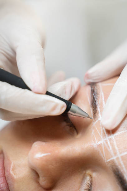 istock Woman during professional eyebrow mapping procedure 1363682245
